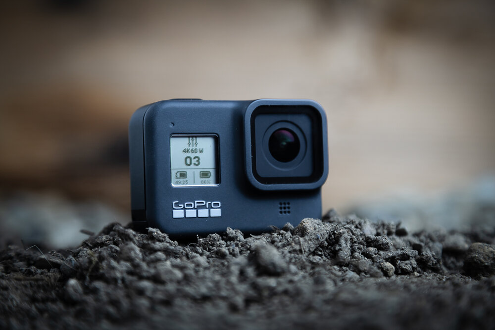 GoPro Hero 8 in the dirt showing the front screen.